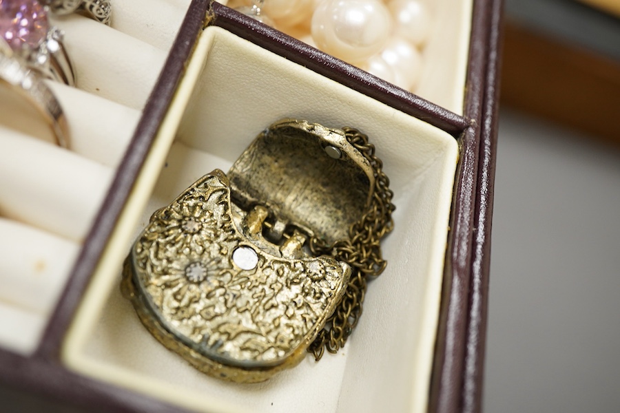 A collection of silver and other costume jewellery, including a diamond cluster ring in 9ct gold, size M, British hallmarks; a citrine ring in 9ct gold, size O, British hallmarks; a citrine ring in low carat gold, size N